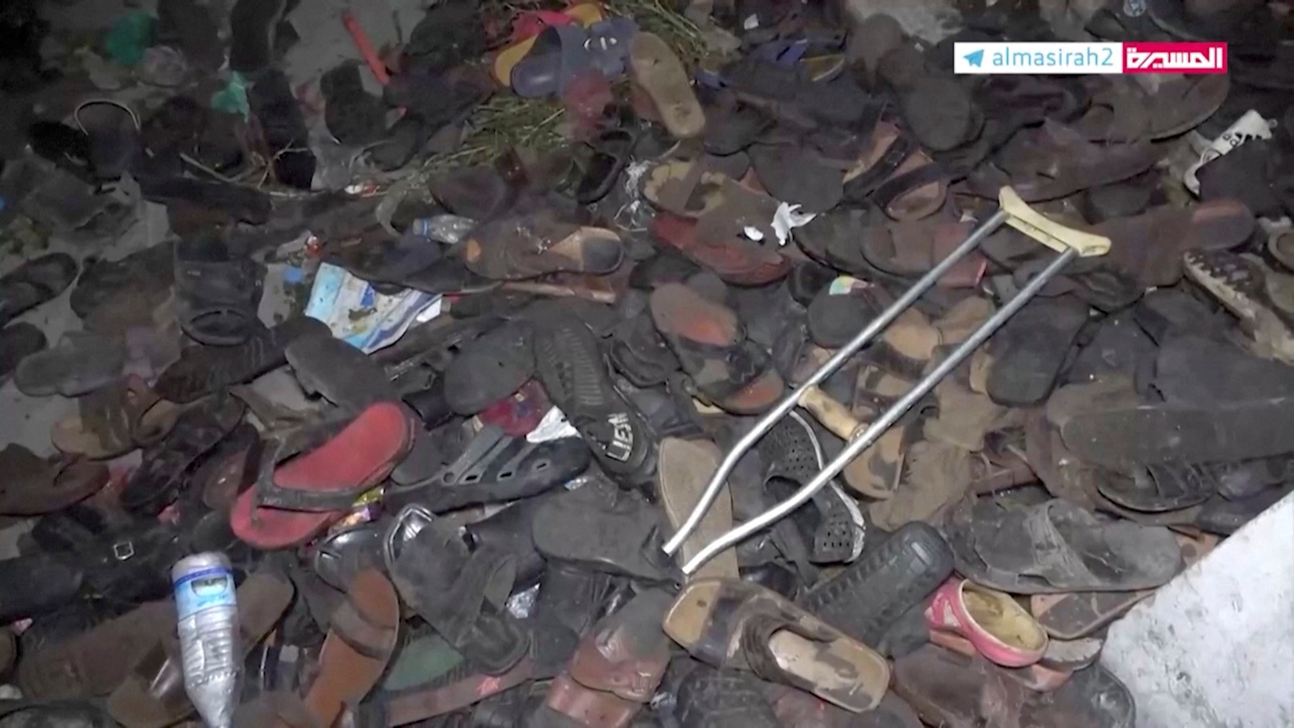 Abandoned footwear and other belongings lie on the ground after a stampede in Sanaa, Yemen, April 19, 2023, in this still image taken from video.  Al Masirah TV/via Reuters TV/Handout via REUTERS