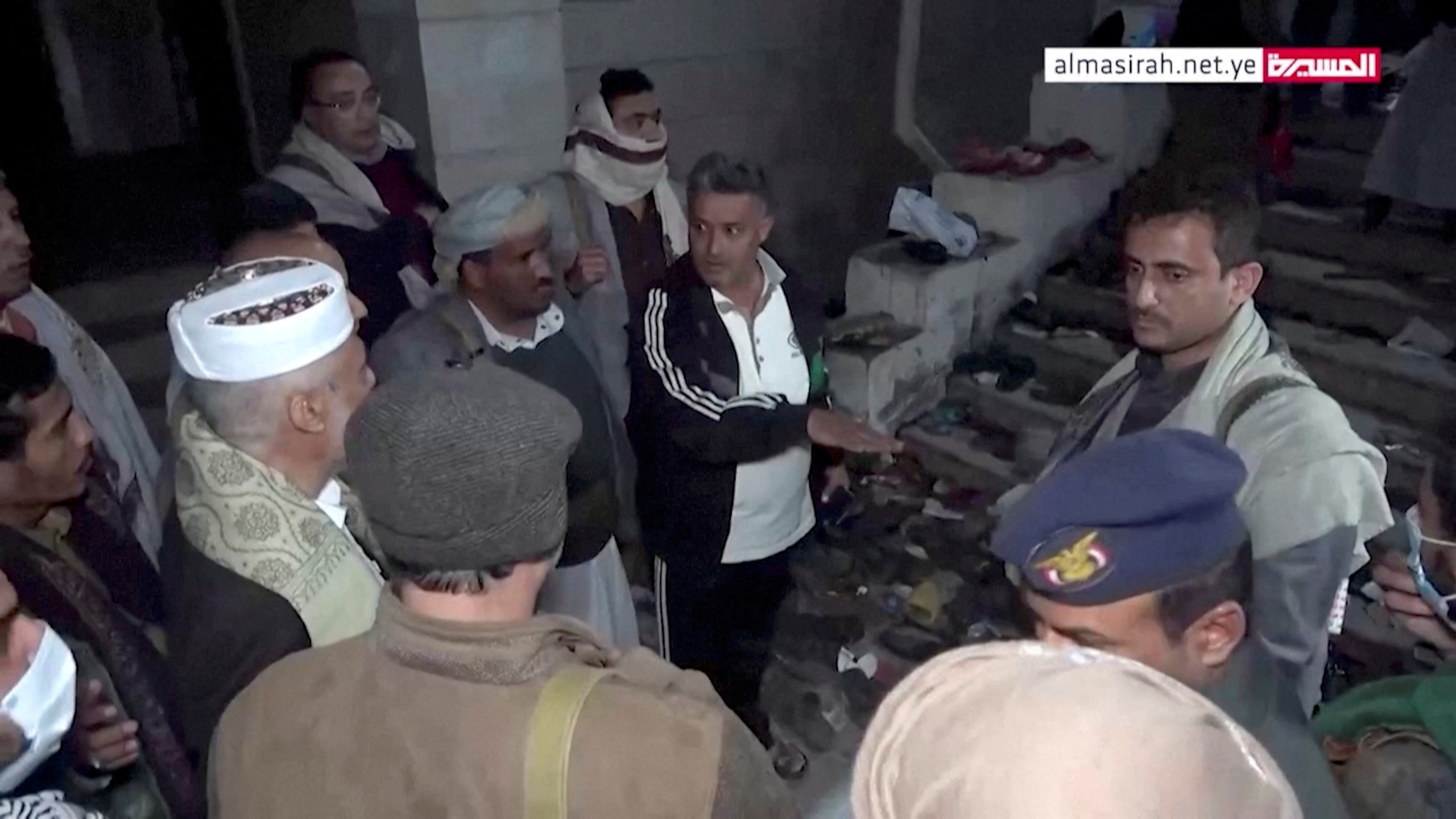 Officials visit the site after a stampede in Sanaa, Yemen, April 19, 2023, in this still image taken from video.  Al Masirah TV/via Reuters TV/Handout via REUTERS