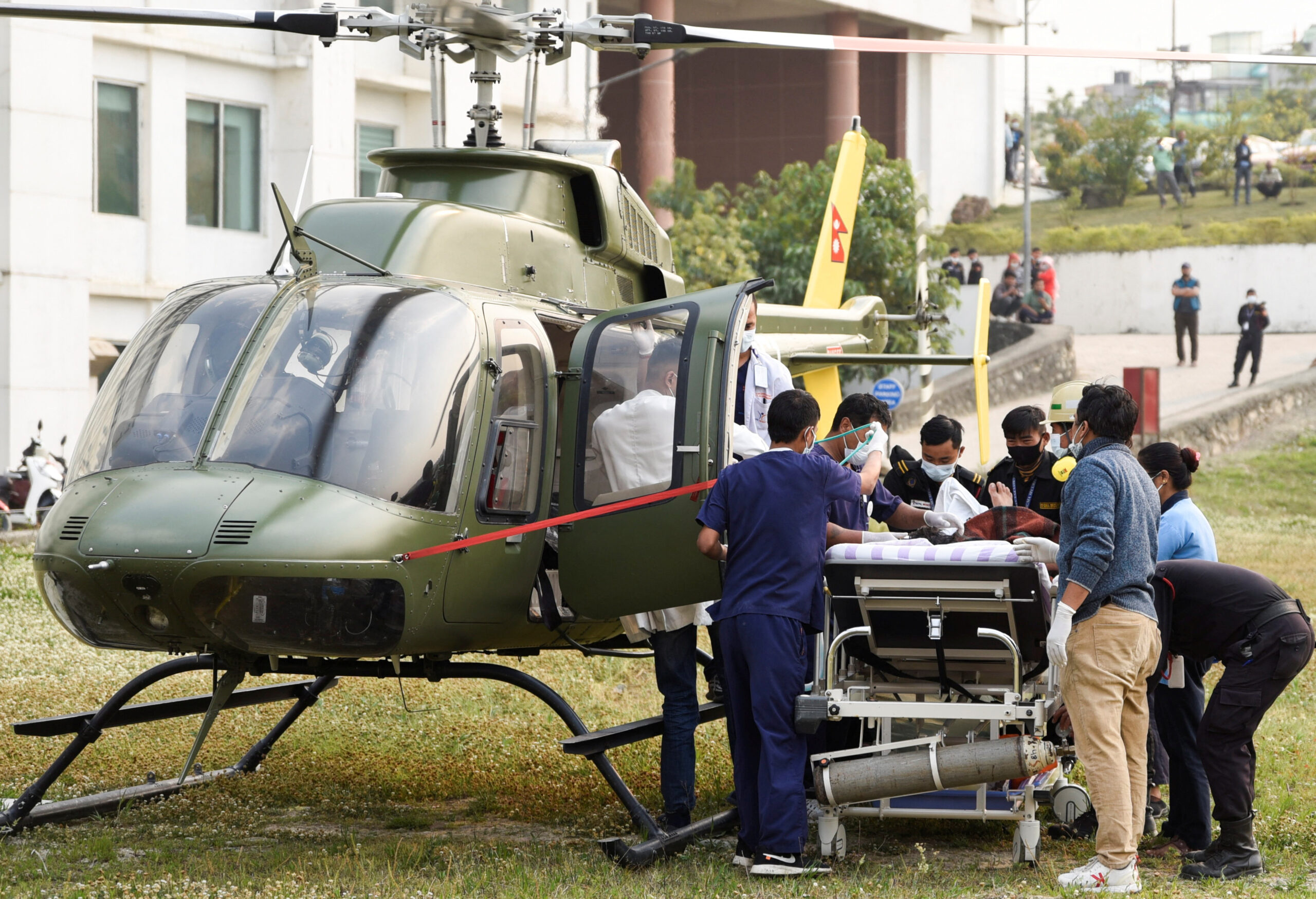 Indian mountaineer Anurag Maloo, 34, is put on a stretcher while being taken out from the helicopter after being rescued from Mount Annapurna, at Nepal Mediciti Hospital in Lalitpur, Nepal. REUTERS/Monika Malla