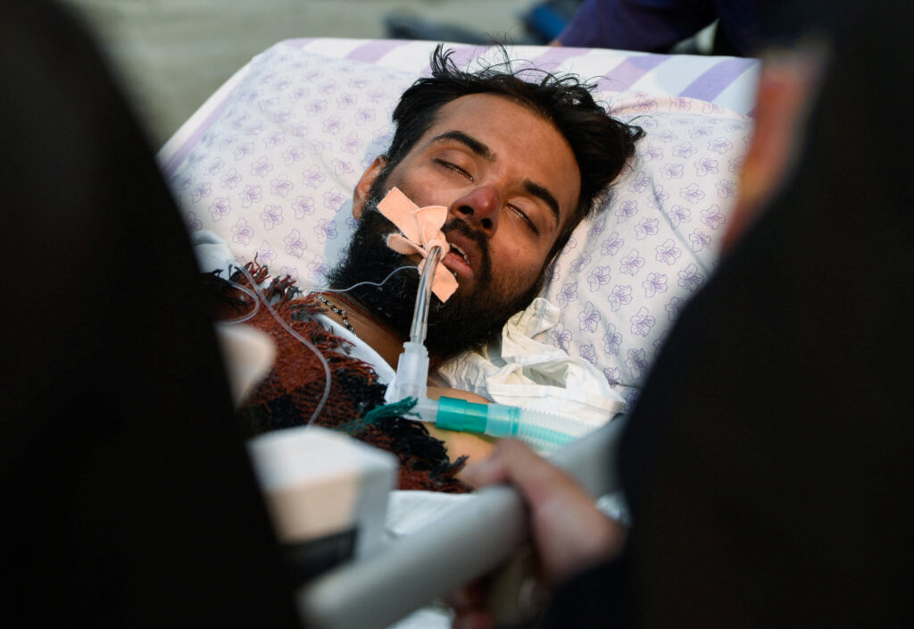 Indian mountaineer Anurag Maloo, 34, lies on a stretcher while being taken into the hospital after getting rescued from Mount Annapurna, at Nepal Mediciti Hospital in Lalitpur, Nepal. REUTERS/Monika Malla