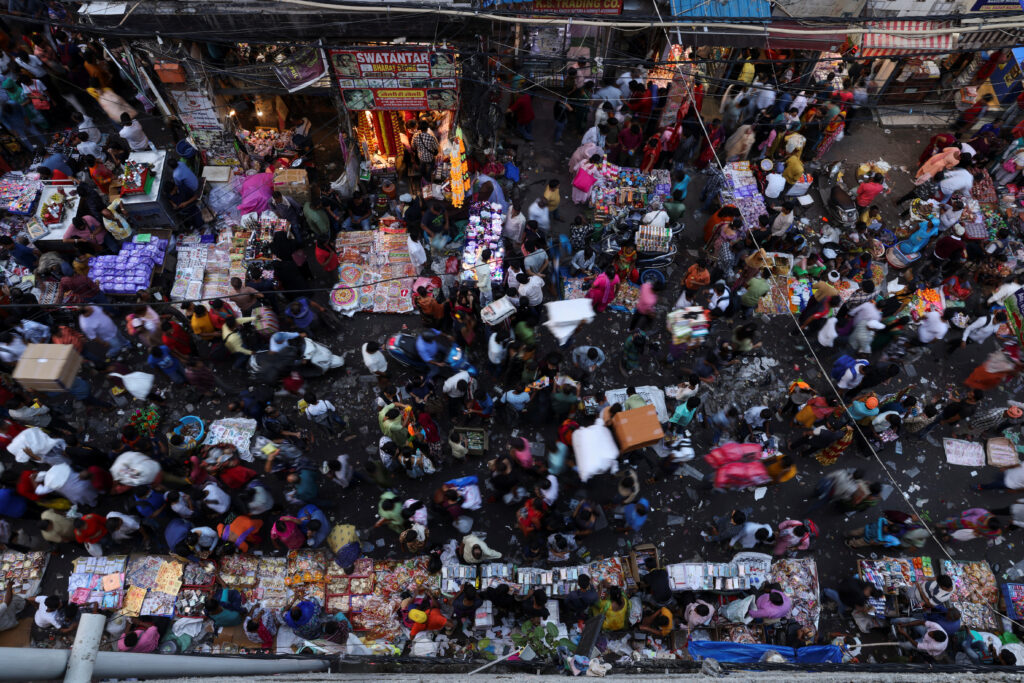 People shop at a crowded market in the old quarters of Delhi, India. REUTERS/Anushree Fadnavis/File Photo