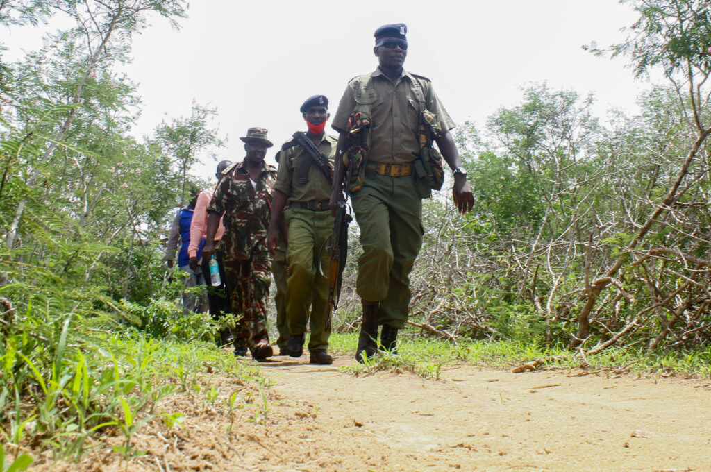 Kenya police officers patrol near the home of a suspected follower of a Christian cult named as Good News International Church, whose members believed they would go to heaven if they starved themselves to death, in Shakahola forest of Kilifi county, Kenya April 25, 2023. REUTERS/Joseph Okanga