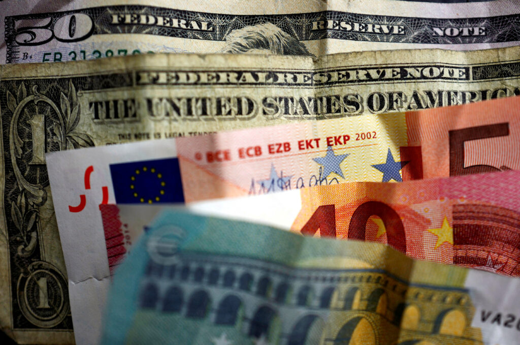 U.S. dollar and Euro bank notes are photographed in Frankfurt, Germany, in this illustration picture. REUTERS/Kai Pfaffenbach/Illustration