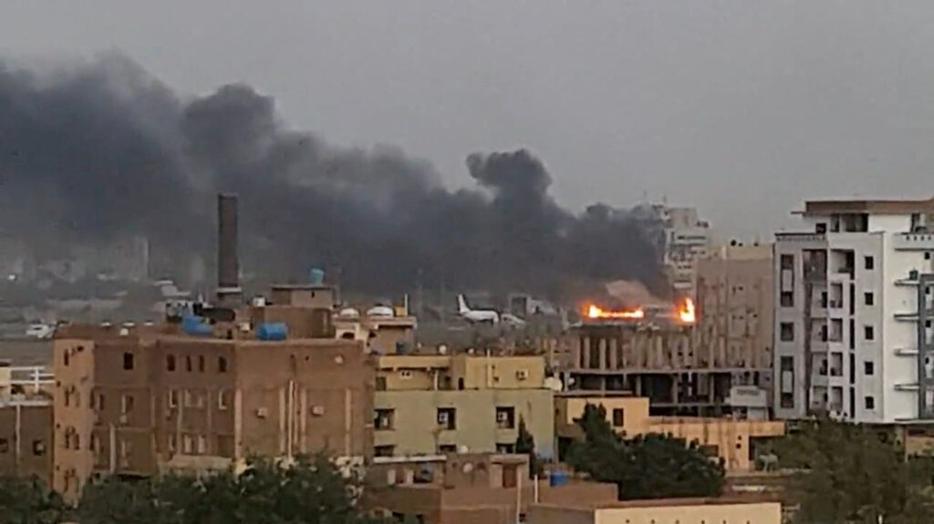 Smoke rises from the tarmac of Khartoum International Airport as a fire burns, in Khartoum, Sudan April 17, 2023 in this screen grab obtained from a social media video. Abdullah Abdel Moneim/via REUTERS