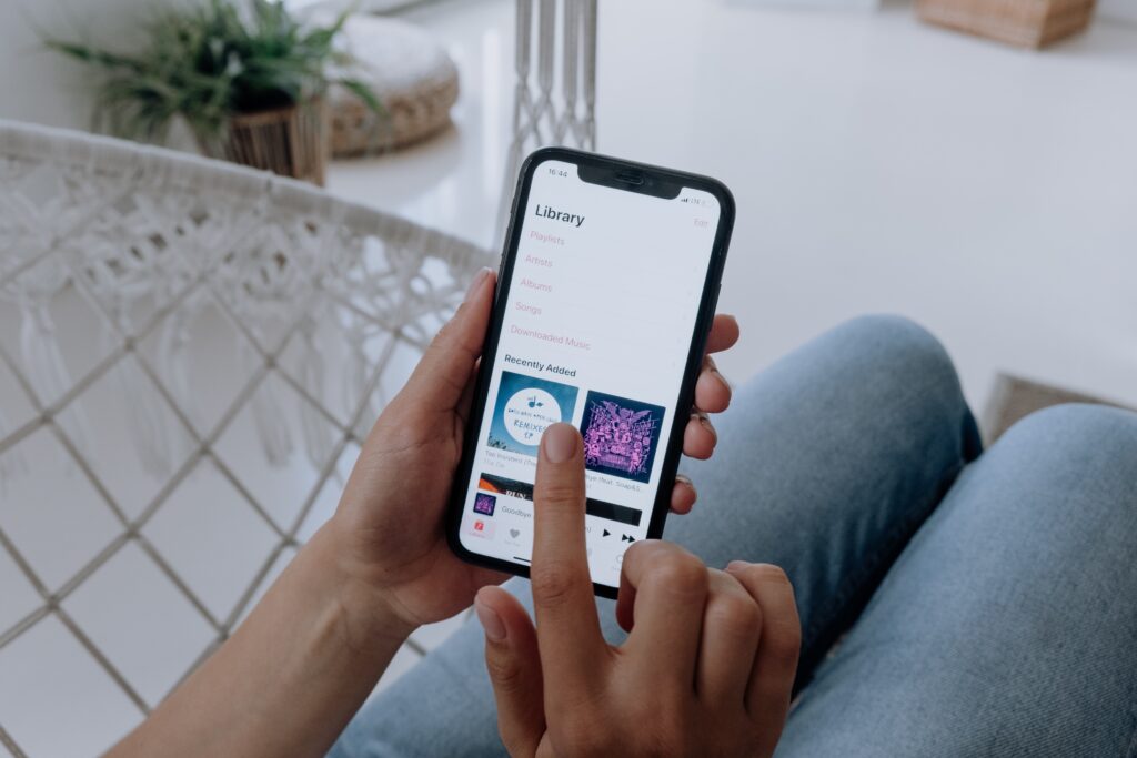 A person listening to music on their phones. Picture: Pexels.