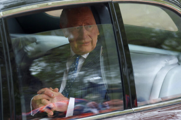 Britain's King Charles is seen in a car ahead of his coronation of in London, Britain May 6, 2023. REUTERS/Paul Childs