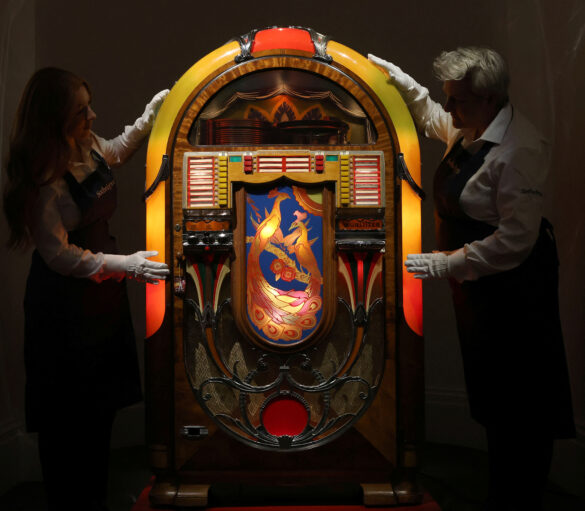Sotheby's handlers examine a jukebox on display, during Sotheby's 'Freddie Mercury: A World of His Own' press preview in London, Britain August 3, 2023. REUTERS/Susannah Ireland