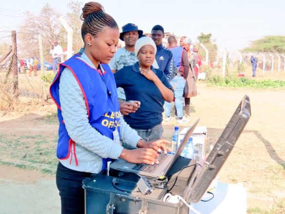 Voters being assisted by an EBC official