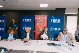 ERS Commissioner General and UNESWA Vice Chancellor Professor Justice M. Thwala exchange signed copies of the Memorandum of Understanding formalising a partnership to deliver specialised AI training for ERS employees through the UNESWA AI Academy. | Photo: ERS